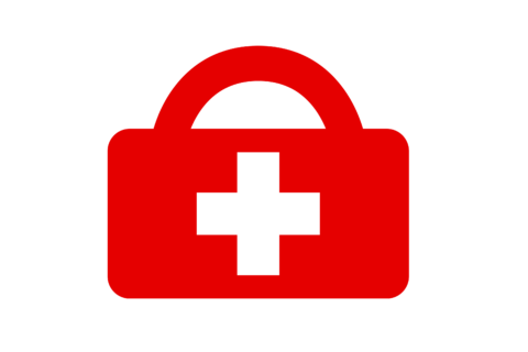 Weißes Kreuz auf rotem Koffer - Erste Hilfe.